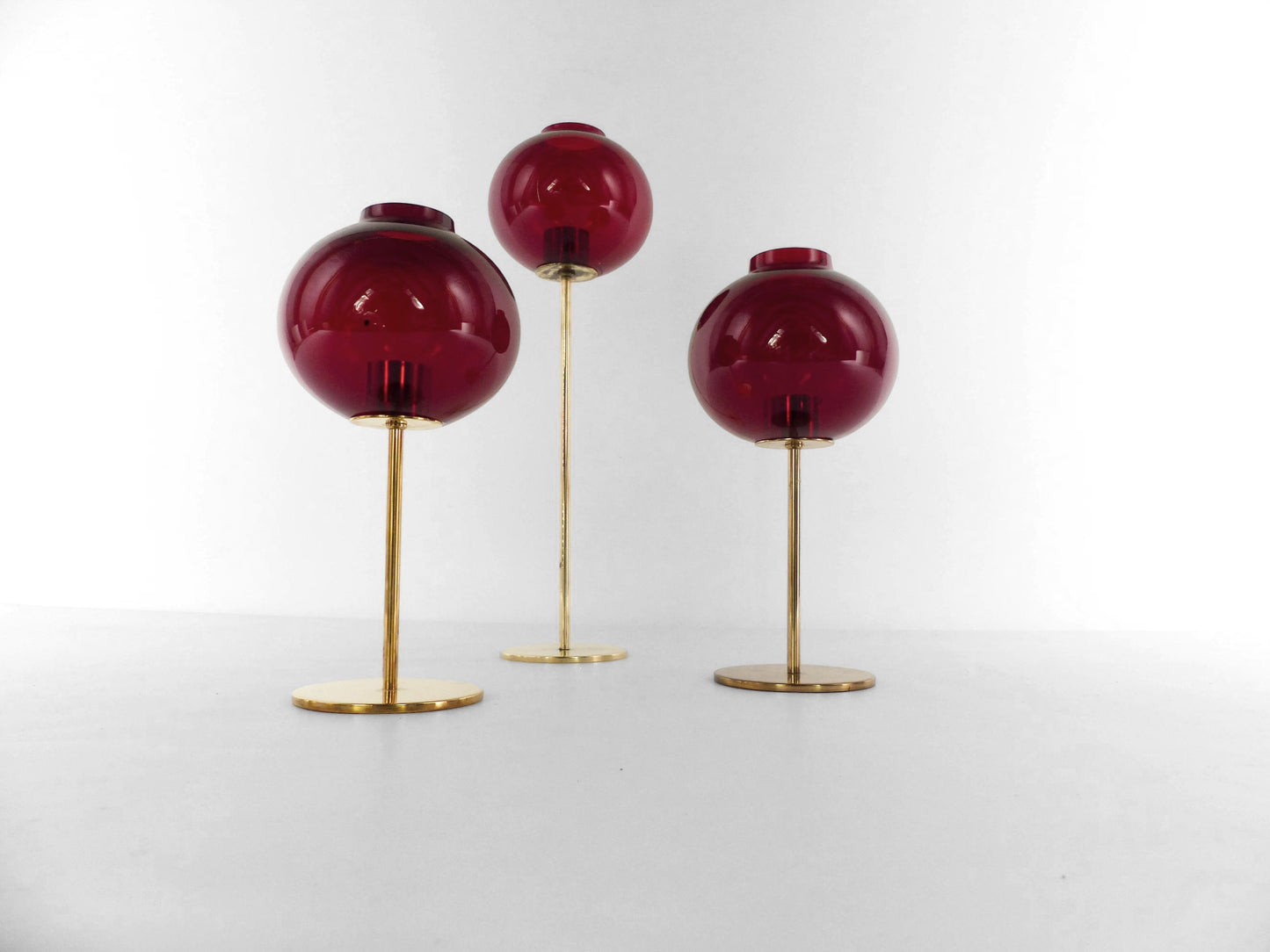 Set of three Hans-Agne Jakobsson AB Markaryd NR135 red tealight candle holders