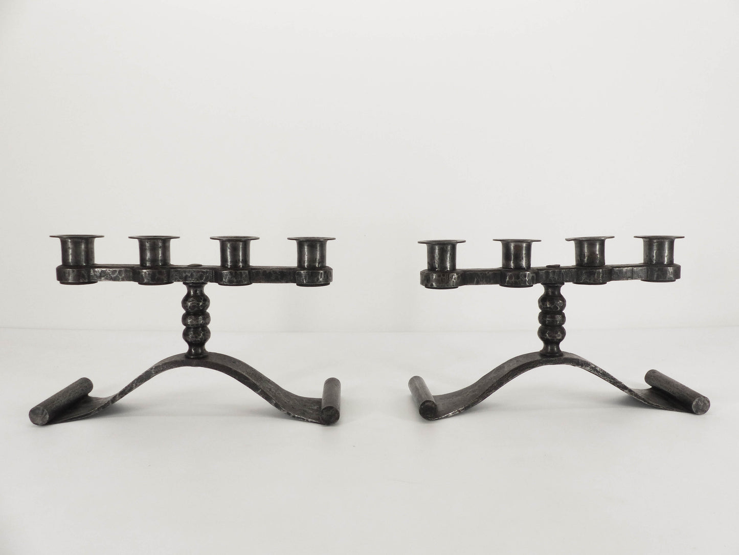 Pair of Charles Piguet brutalist wrought iron candlesticks