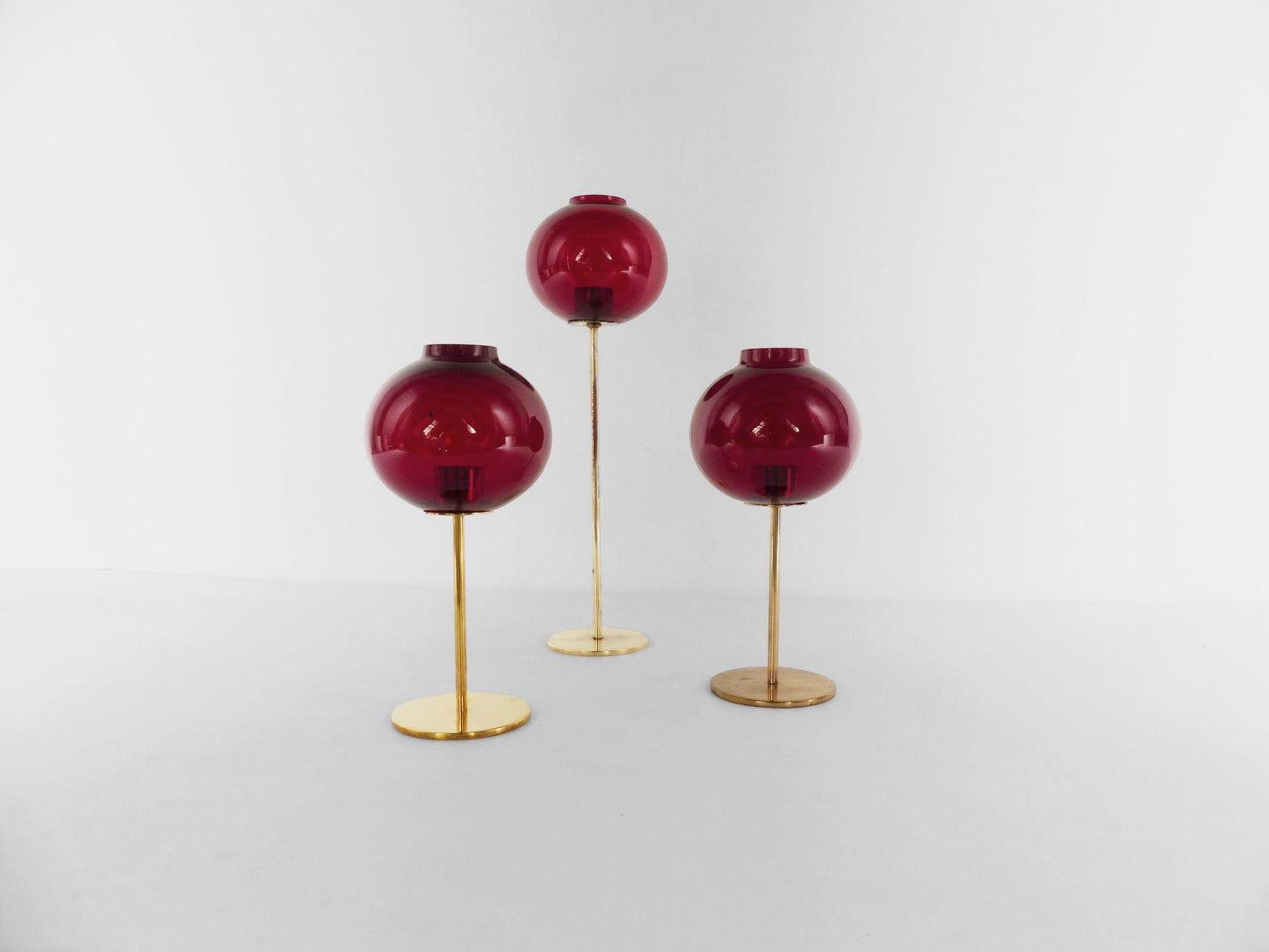 Set of three Hans-Agne Jakobsson AB Markaryd NR135 red tealight candle holders