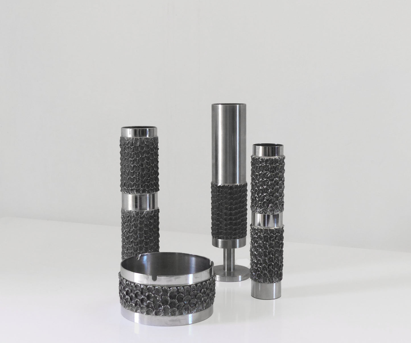 BRUTALIST SET OF METAL VASES AND ASHTRAYS