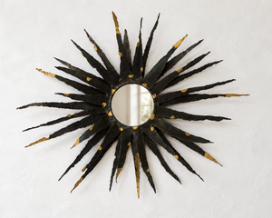 Large brutalist sunburst mirror in patinated metal with gold-toned accents – europe, circa 1970