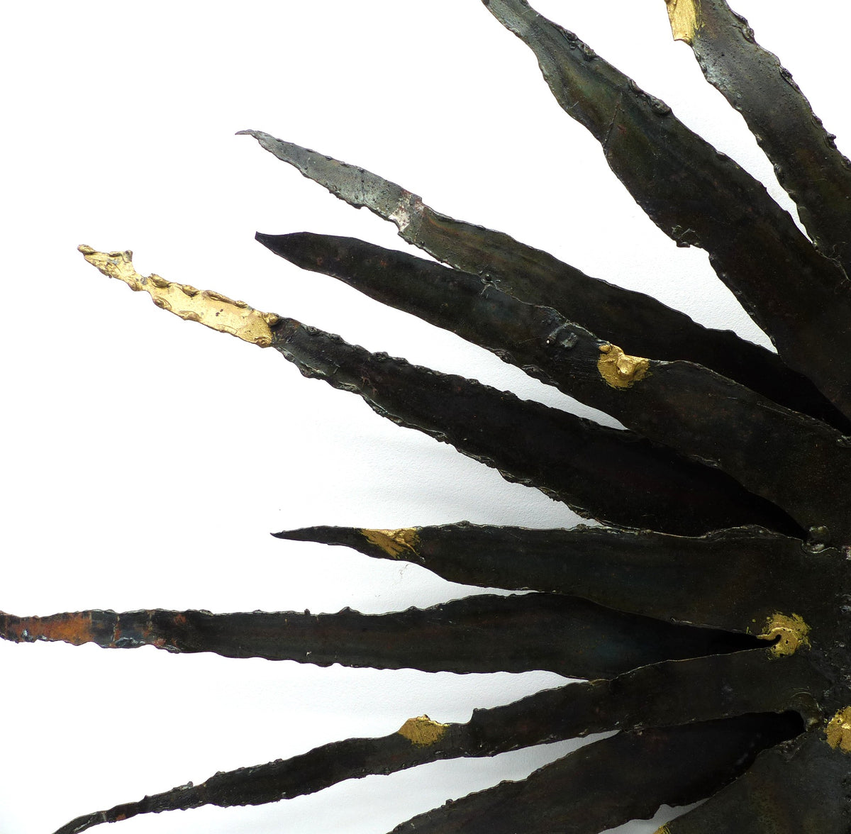 Large brutalist sunburst mirror in patinated metal with gold-toned accents – europe, circa 1970